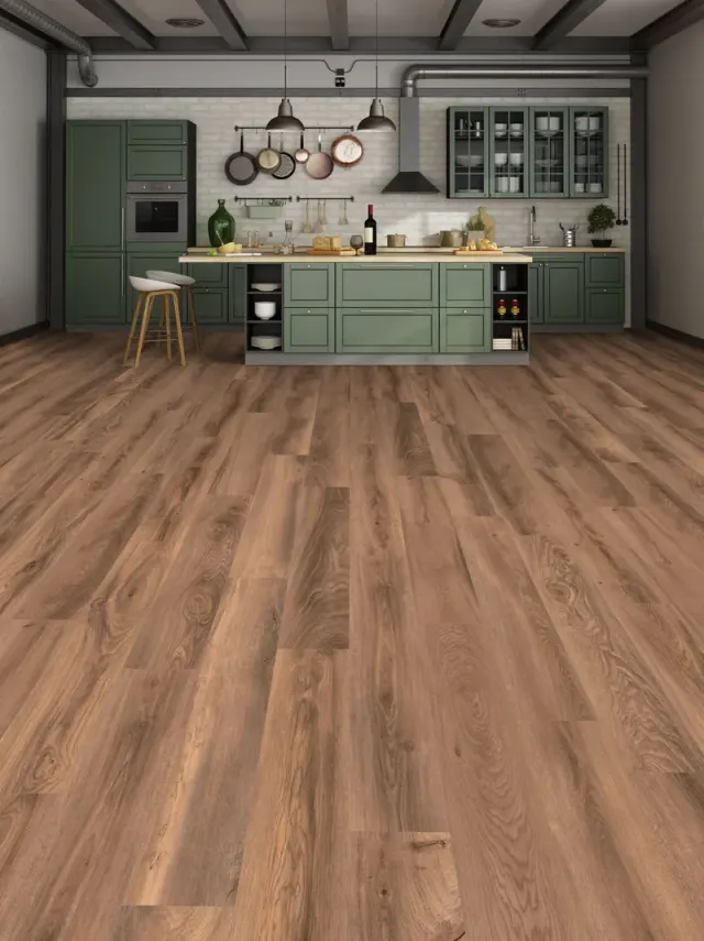 Industrial-style kitchen with green cabinetry and warm wood-look flooring.