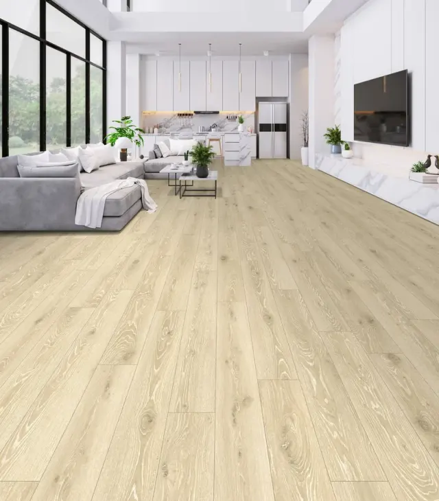 Open-concept loft living room and kitchen with light wood-look flooring.