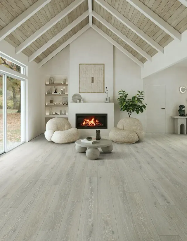 Vaulted-ceiling living room with a fireplace and light wood-look flooring.