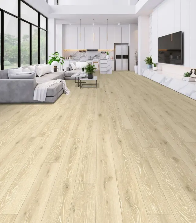 Open-concept loft living room and kitchen with light wood-look flooring.